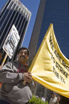 Janitors March and Threaten to Strike