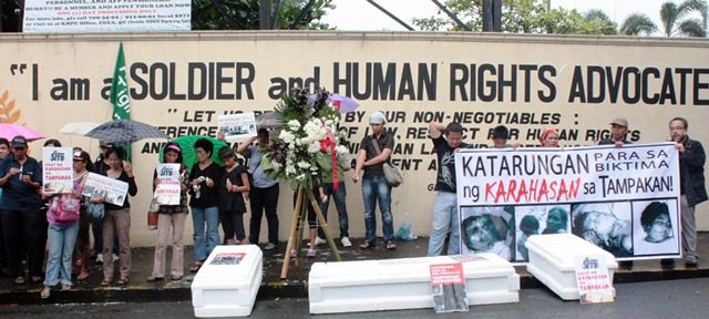 Coffins in front of Camp Aginaldo