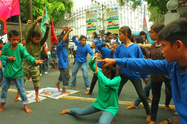 Members of the Southern Tagalog Cultural Network perform a dance in honor of the two slain activists in front of the DOJ, Monday. (Photo by Ronalyn V. Olea / Bulatlat.com)