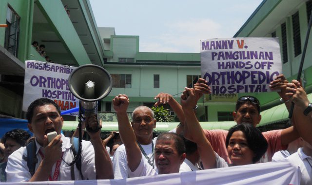 Health workers and employees of the Philippine Orthopedic Center walk out during lunch break as protest against the hospital's looming "modernization." (Photo by Anne Marxze D. Umil/ bulatlat.com)