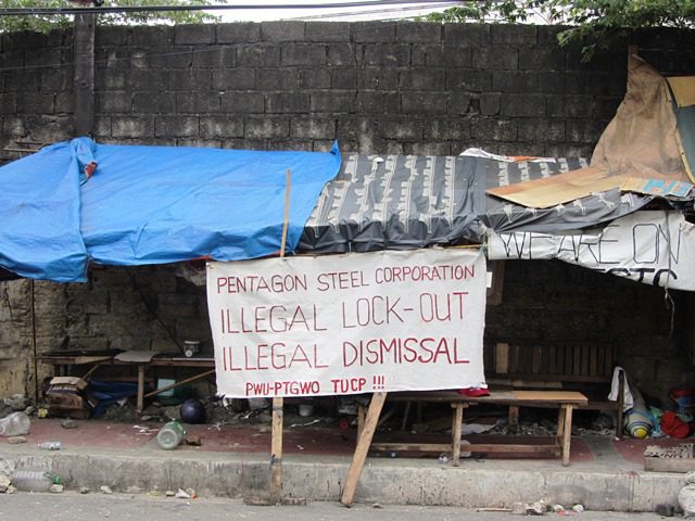 Picketline's makeshift tent by the gate of Pentagon Steel Corp, after Pentagon security guards ransacked it July 13