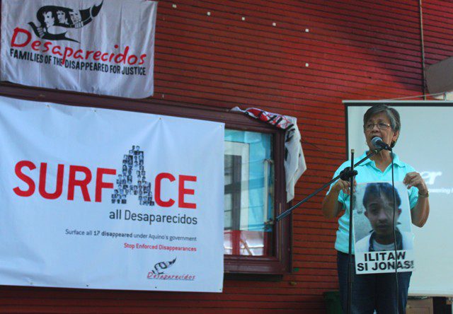 Mrs. Edita Burgos shows a photograph of Jonas. The photo, believed to be taken after the abduction, is among the new evidence filed with the Supreme Court. (Photo by Ronalyn V. Olea/ Bulatlat.com)