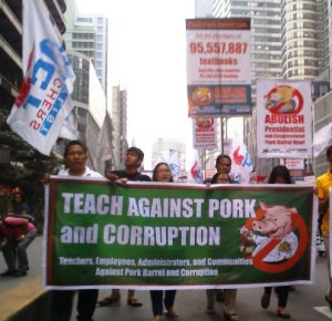Public school teachers marching towards Paseo Roxas in Makati City for the second Million People March on Friday, Oct. 4. (Photo by Anne Marxze D. Umil/Bulatlat.com)