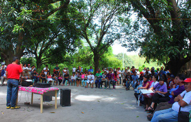 Members of the fact-finding mission and the local farmers hold a program at the Manggahan, Purok 5 in Hacienda Dolores, Porac, Pampanga. (Photo by Ronalyn V. Olea/ Bulatlat.com)