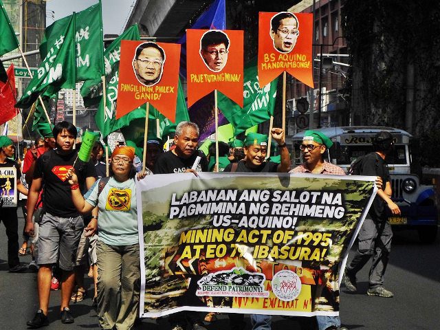 Peasants, workers, members of IP groups, environmentalists, scientists and students march toward Mendiola Bridge to show their anger at the government officials and businessmen behind the sellout of PH resources (Photo by Mon Ramirez, arkibongbayan.org)
