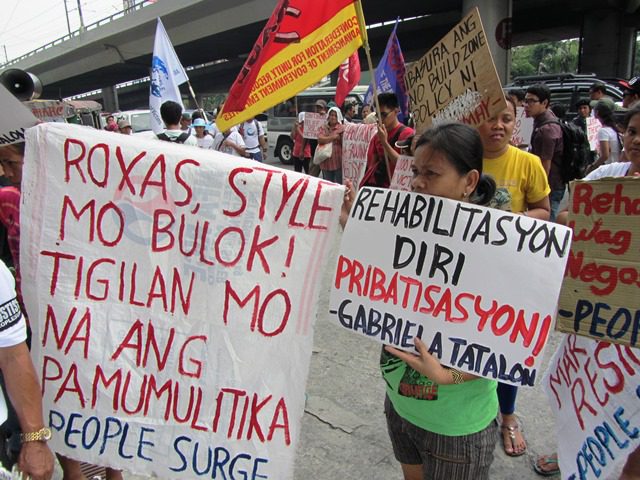 In a protest in front of DILG office, members of People Surge deplore the actions of Sec. Mar Roxas and warn the public against his presidential ambition. (Photo by M. Salamat / bulatlat.com)