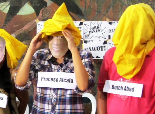 THAT's ENTERTAINMENT? UP FacPork shows Aquino as literally draping in cover-up his allies, Budget Sec. Abad and Agriculture Sec Alcala, who are both implicated in pork barrel scam. (Photo by M. Salamat / bulatlat.com)