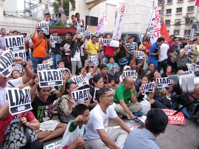 Members of progressive organizations strike down Aquino's DAP defense as lies, in a protest action at Plaza Miranda (Photo by M. Salamat / Bulatlat.com)