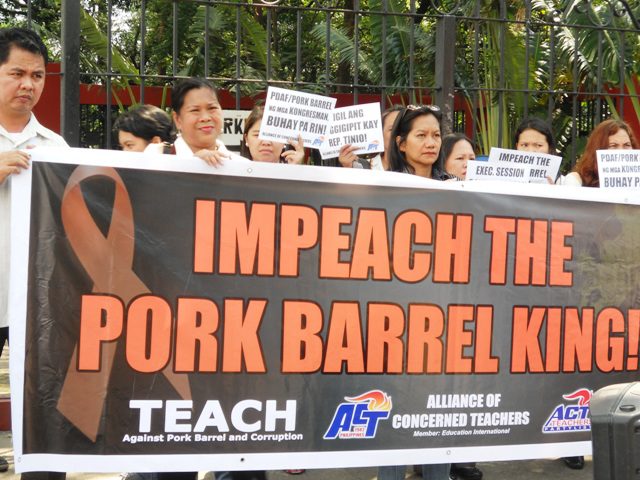Public school teachers stormed the House of Representatives on Wednesday, Aug. 13 to show support for ACT Partylist Rep. Antonio Tinio. They said Tinio should be lauded for exposing the hidden pork barrel in 2014 national budget. (Photo by A. Umil/ Bulatlat.com)