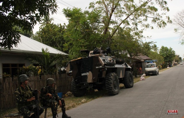 Soldiers and armored personnel carrier posted in Dapyawan village, Datu Saudi Ampatuan, Maguindanao (Photo by Kilab Multimedia)