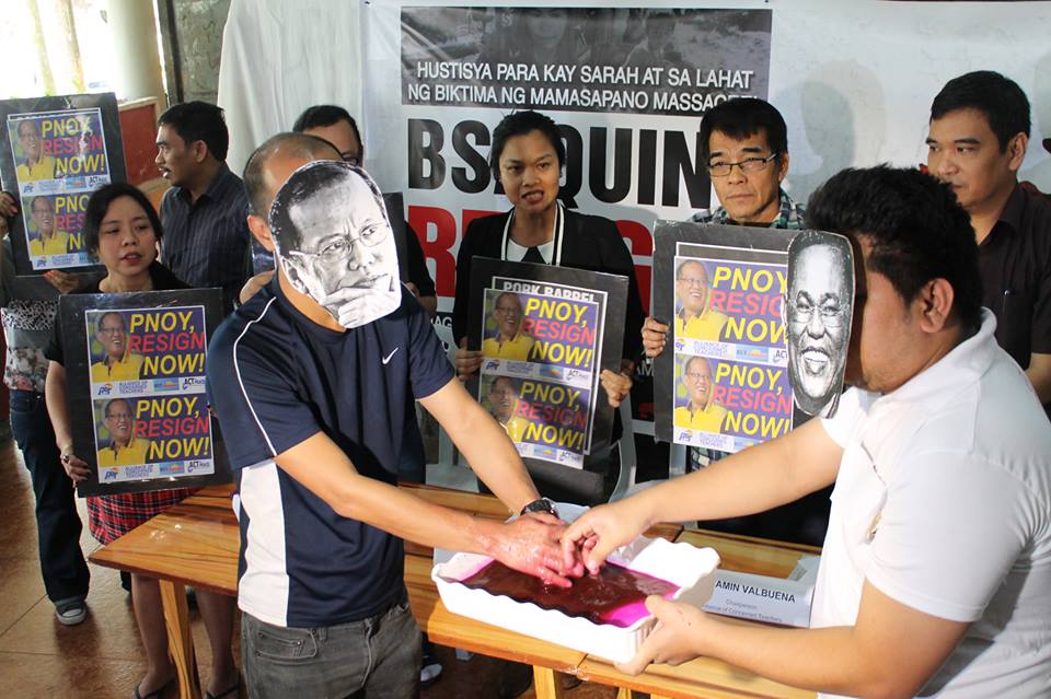 Teachers depict a symbolic "washing of bloodied hands" by President Aquino" and ex-PNP chief Alan Purisima. (Photo by Contend)