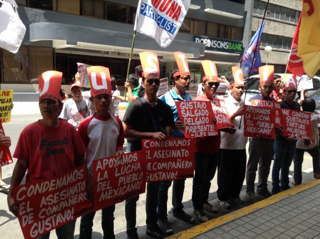 Filipino activists hold a solidarity protest demanding for justice for brutal slay of activist Gustavo Salgado Delgado (Photo by J. Ellao / Bulatlat.com)