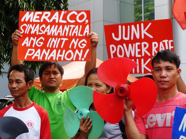 Members of KMU and AWU blast Meralco's taking advantage of summer heat to justify rate hike (contributed photo, Apr 13, 2014 / Bulatlat.com)