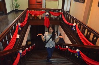The author at the staircase leading to the second level (Photo by C. Cabanatan/Bulatlat.com)