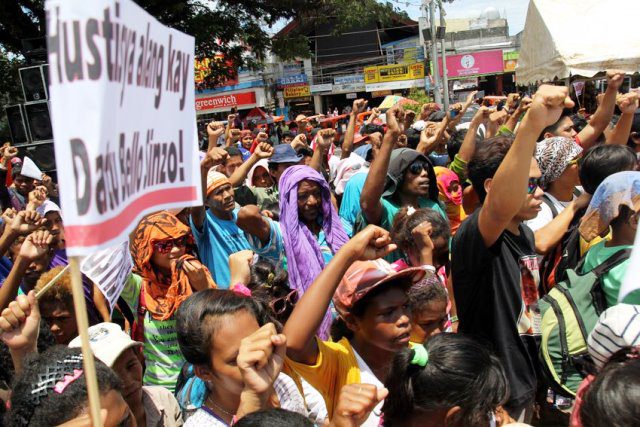 People raise their fists for Emerito Samarca as the sign to continue the struggle what was left by there Sir Emok.