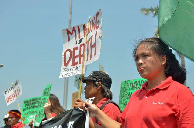 A protester from Didipio, Nueva Vizcaya where mining operations by OceanaGold and FCF Minerals had polluted the rivers (Photo by Kalikasan PNE/Bulatlat.com)