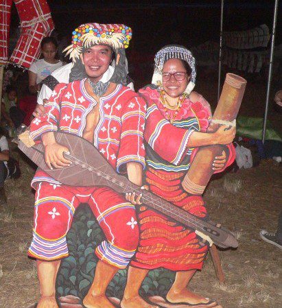 Visitors take pictures in Manobo standees (Photo by D.Ayroso/Bulatlat,com)