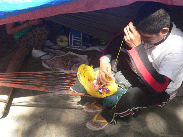 Lumad activist makes bead jewelry (Photo by D.Ayroso/Bulatlat.com)