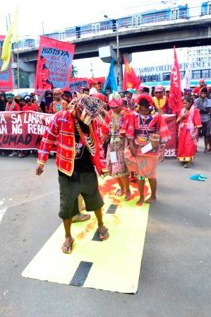 BLOOD-STAINED PATH. Lumad protesters depict how the Liberal Party's "tuwid na daan" is smeared with the blood of   its indigenous peoples defending their ancestral lands. (Photo by Manilakbayan)