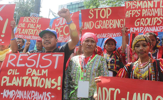 Farmers and indigenous peoples stage a protest Nov. 4 in front of the Department of Environment and Natural Resources (DENR) against government's plan to expand oil palm plantations in the country. (Photo by Ronalyn V. Olea / Bulatlat)