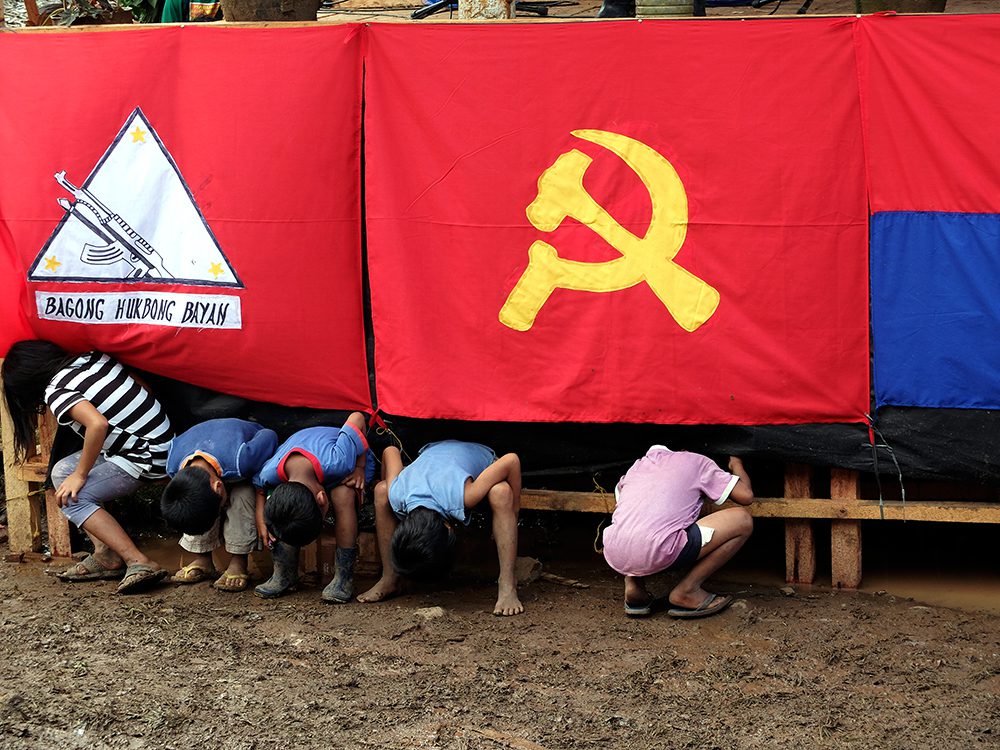 They had the best seat in the house for the CPP's 47th founding anniversary celebrations, but they still wanted to see things going on backstage. (Kitcharao, Agusan del Norte)