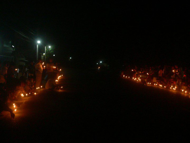 Bayto residents on the road in a prayer and candle-lighting activity with church, peasant and environmentalist groups. (Photo by D.Ayroso/Bulatlat)