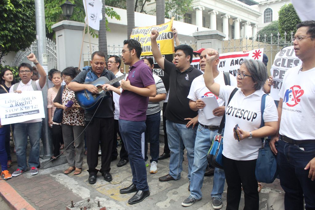 BULATLAT FILE PHOTO. Rebecca T. Añonuevo, the woman in white shirt (second to the right), during the anti-K to 12 protest in the Supreme Court. (Photo by A. Umil/ Bulatlat)