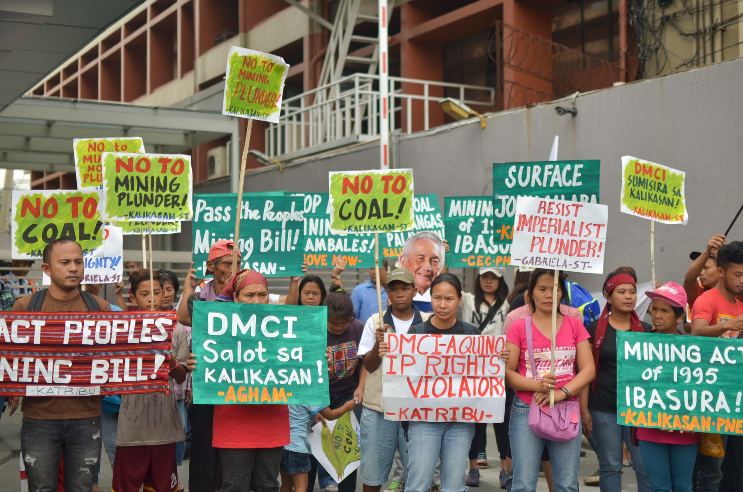Members of environmentalists and mining-affected communities from Mindanao and Luzon joined the protest at the DMCI office in Makati City on March 3. (Photo by Carlo Manalansan/Bulatlat)
