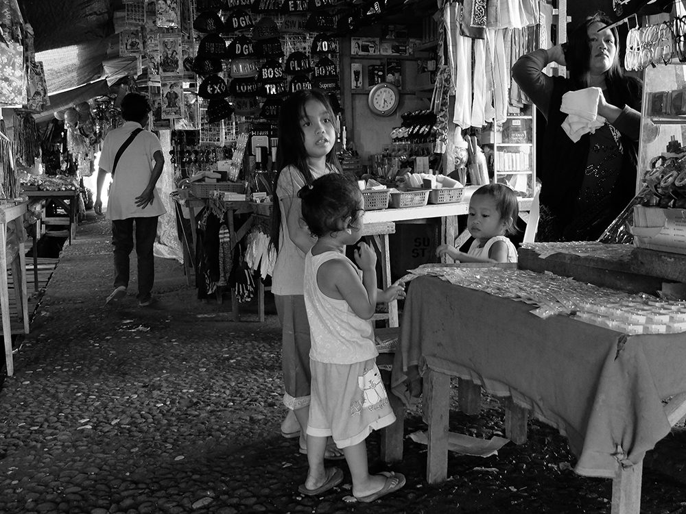 While an elderly's body language shows her predicament, these young ones are themselves catching their breath from relentless play. (Bislig City, Surigao del Sur)
