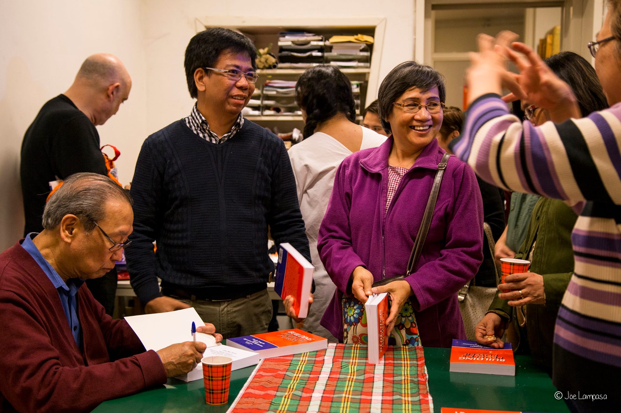Author signs book copies of Prof.Gealogo and Joy Sison