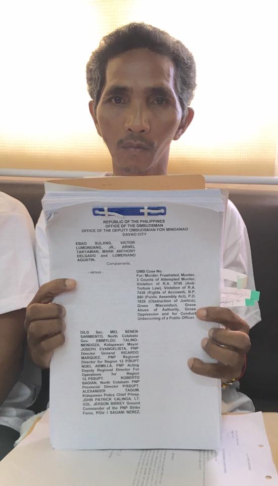 Ebao Sulang, father of slain farmer Darwin, leads filing of charges against local and national government officials. (Photo courtesy of Cristina Palabay)