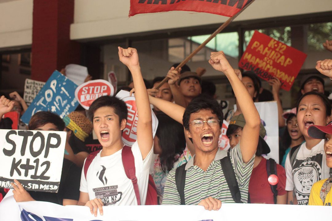 Students occupy the compound of the Department of Education during a protest against the K to 12 program, May 28. (Photo by Gino Estella / Bulatlat)