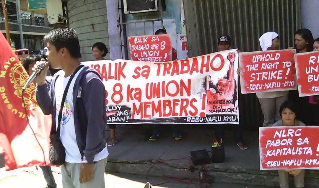 Members of Kilusang Mayo Uno – Southern Mindanao hold a protest action, May 30, at the RMN Anda Station to condemn the termination of RMN Davao union officers. (Contributed photo)