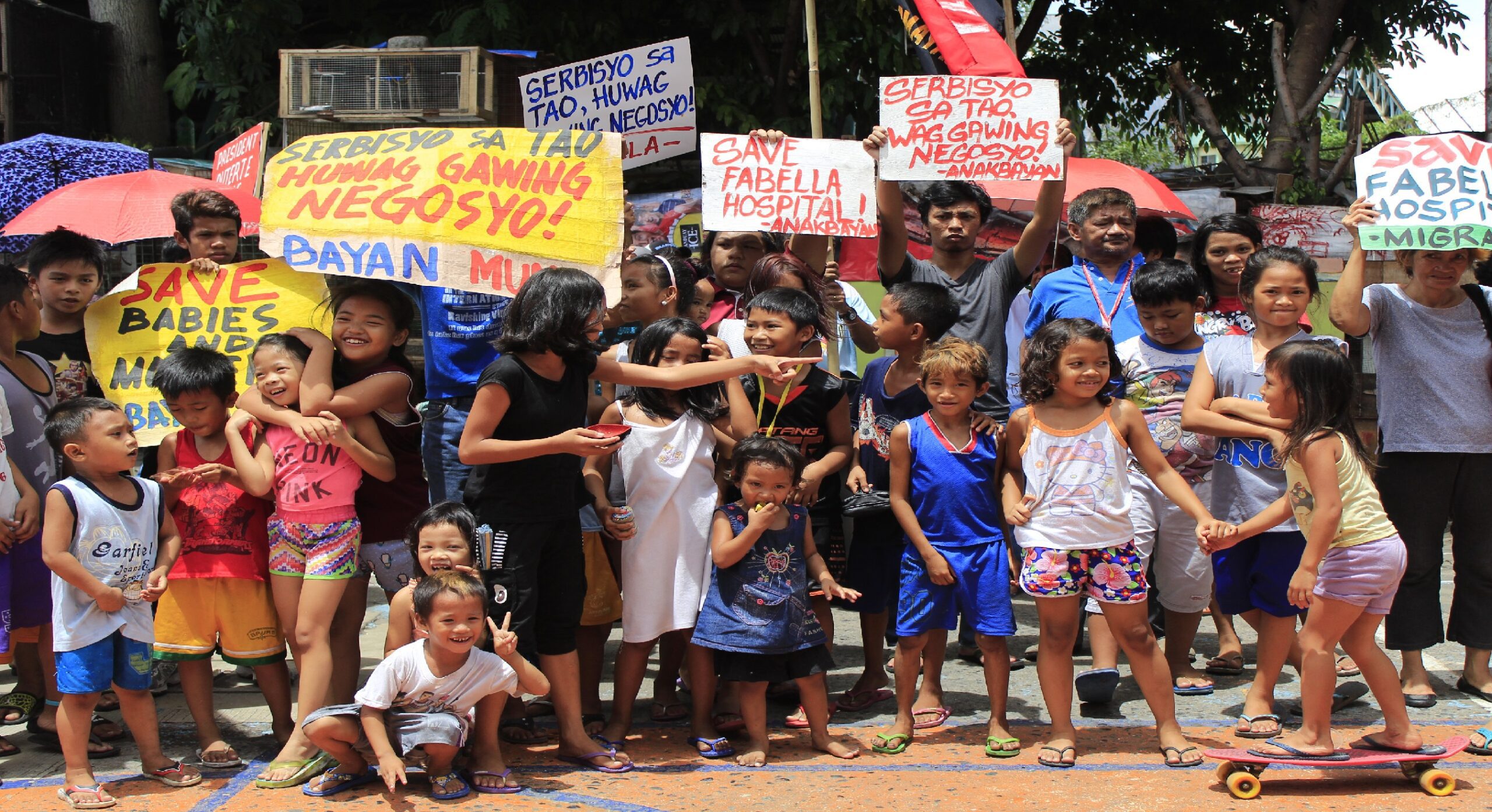 BORN IN FABELLA. Children join the protest against the eviction of the century-old hospital. (Photo by K. A.Macalalad/Bulatlat)