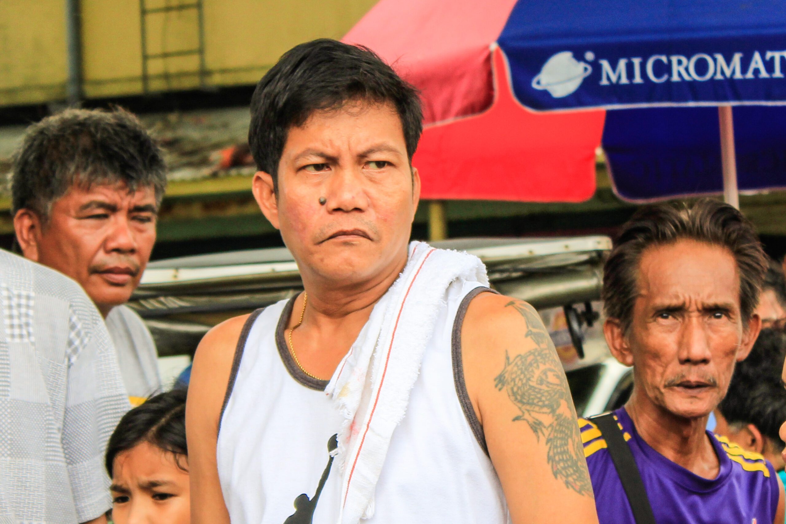 Martial Santos, 42, is among Barangay 312 residents who formed a barricade outside the hospital to stop the pull-out of equipment. (Photo by K.A.Macalalad/Bulatlat)