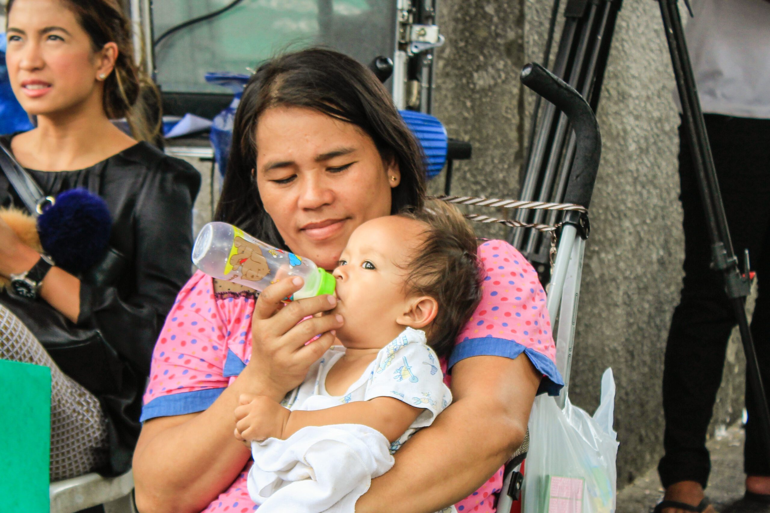 Conchita Sayosa, 36, with her youngest child born at the Dr. Jose Fabella Memorial Hospital (Photo by K.A.Macalalad/Bulatlat)
