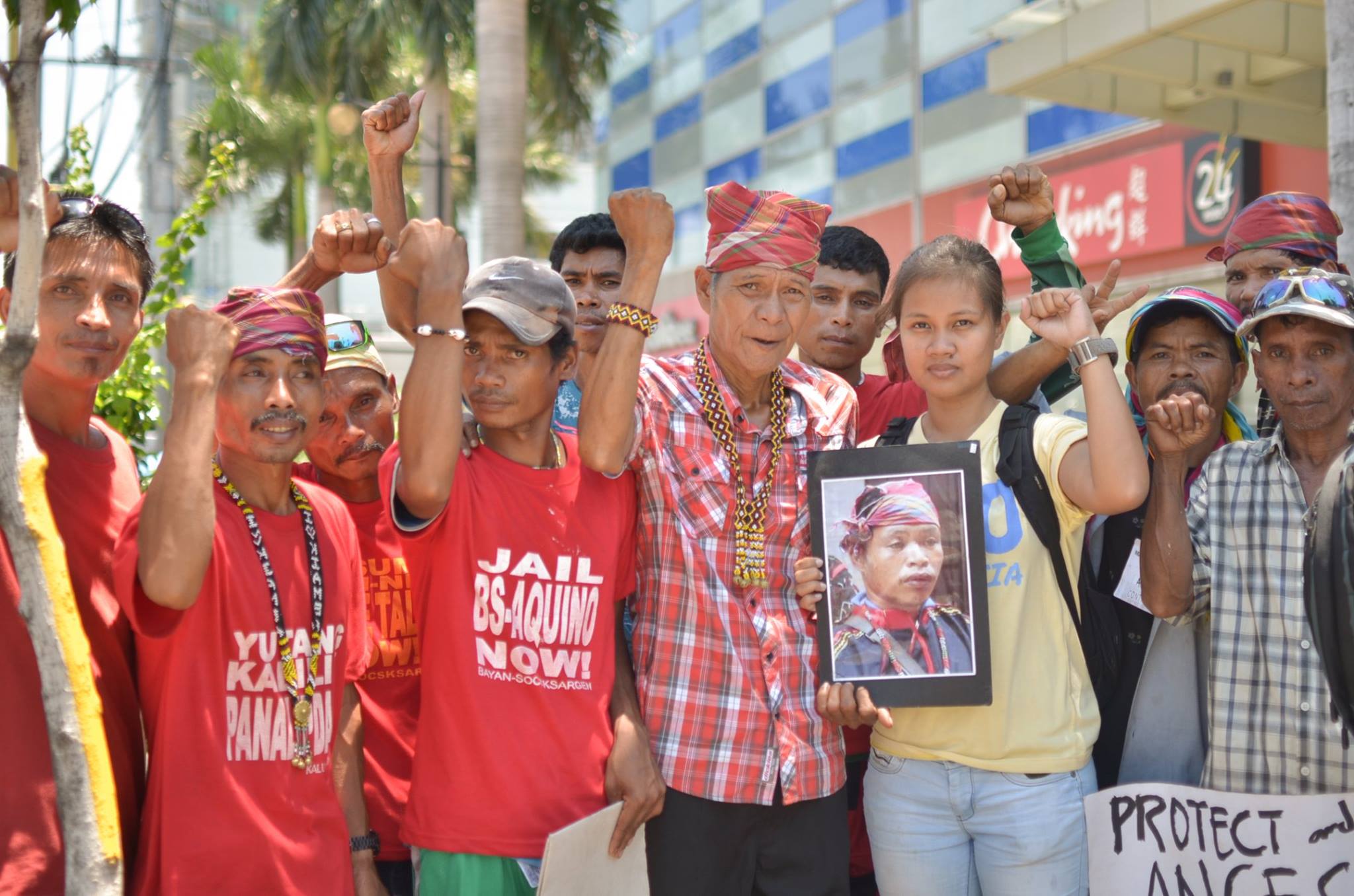 The author, together with Dulangan Manobos who travelled to DMCI’s headquarters in Metro Manila to join the protest of various communities affected by DMCI extractive projects. By Loi Manalansan/Kalikasan PNE