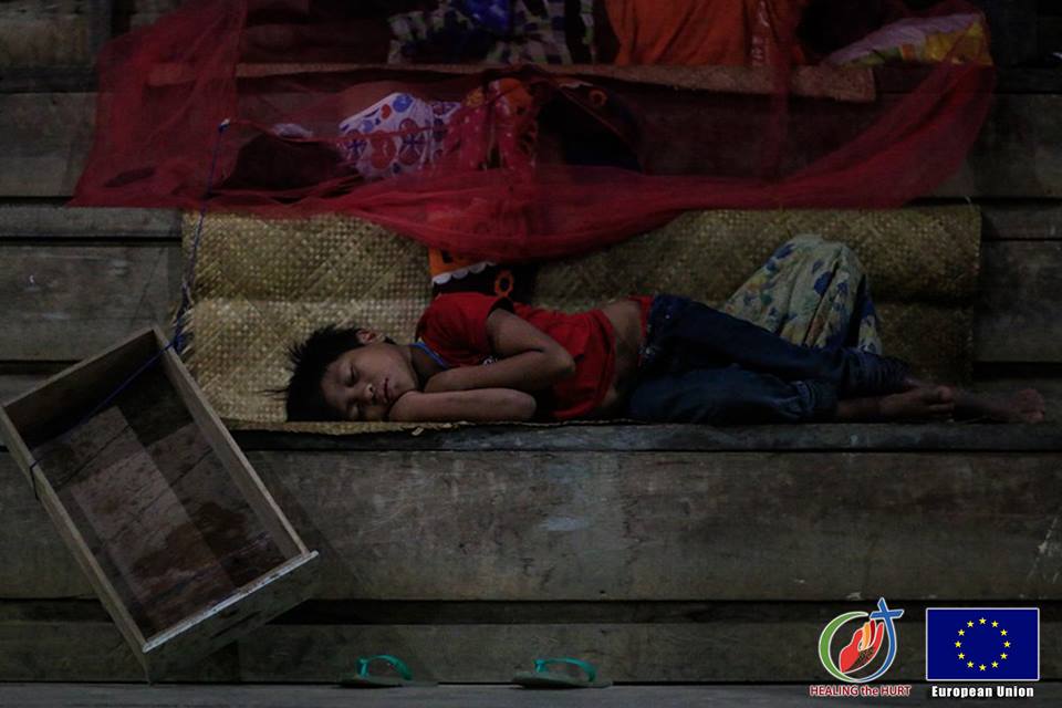 Manobo children sleep at the public gym in Zillovia village proper, Talacogon, Agusan del sur where they evacuated on July 4. (Photo courtesy of Healing the Hurt Project)