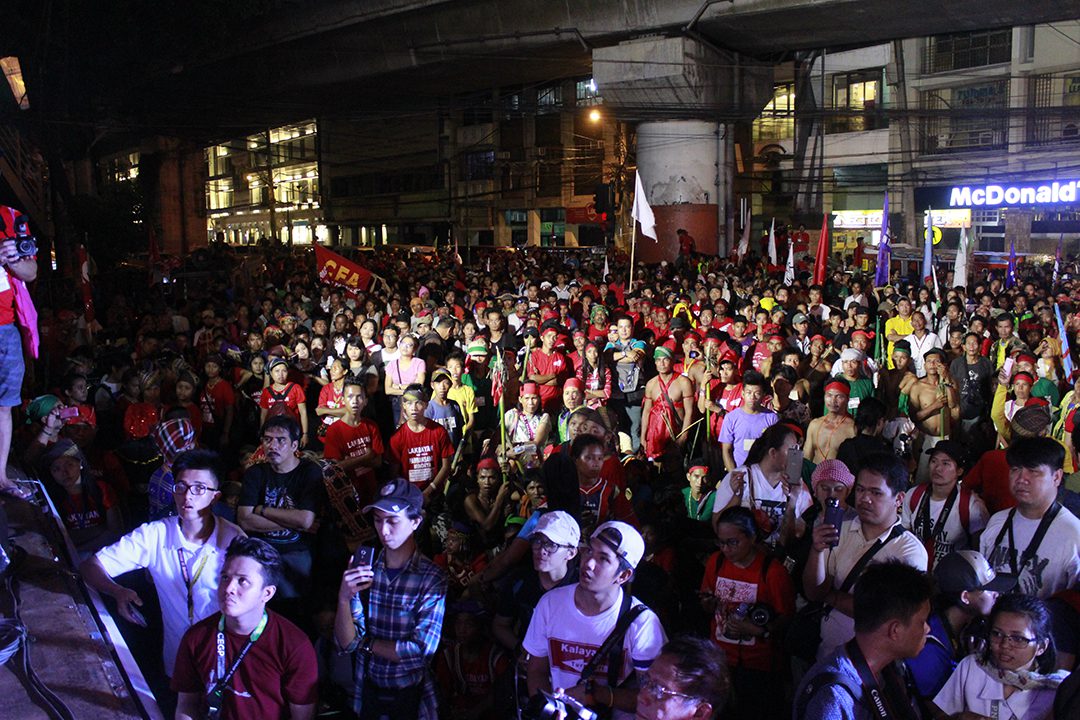 Activists and supporters of the rights of national minorities protest the continuing non-recognition of their right to self determination in front of the presidential palace in the Philippines. (Photo by Sham Astudillo/IPMSDL) 