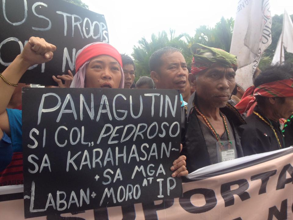 Sandugo members call to hold MPD officer Pol.Senior Supt. Marcelino Pedrozo Jr. in a program at Quezon Hall in UP Diliman on Oct. 20. (Photo by Kathy Yamzon)