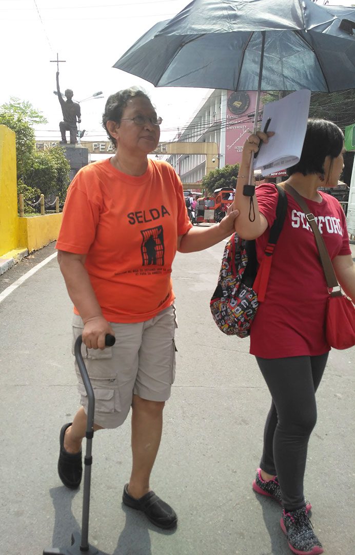 Marie Hilao-Enriquez (left), SELDA chairperson, says the rigorous process imposed upon martial law victims by the Claims Board is unnecessary.  (Photo by Ronalyn V. Olea / Bulatlat)