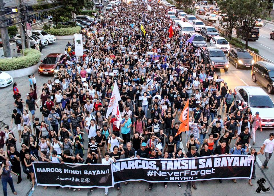 UP students, faculty and workers march with other activists along Katipunan, to meet up with their counterpart from Miriam College and Ateneo (Photo courtesy of Chester Higuit/Philippine Collegian)