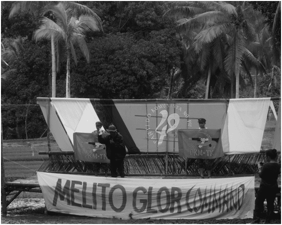 A leader of the Pambansang Katipunan ng mga Magsasaka sa Timog Katagalugan (PKM-TK) gives a solidarity statement. He said peasants continue to reap the fruits of revolutionary land reform in the countryside, such as reduced land rent, lower interest loan and higher agricultural productivity. (Bulatlat photo)