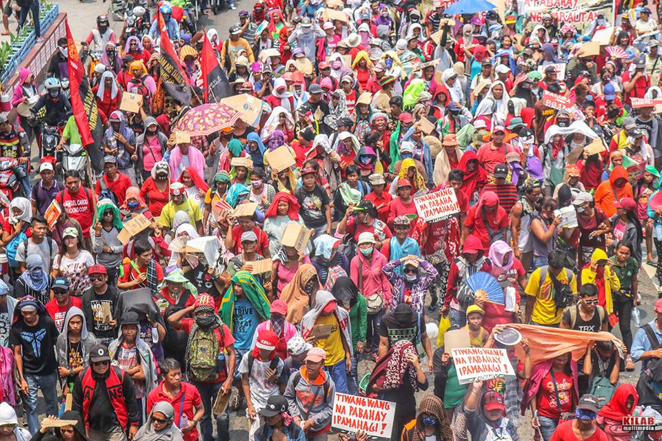 Urban poor from the occupied government housing units in Pandi, Bulacan made up the biggest bulk of the May Day protesters (Photo by Kilab Multimedia)