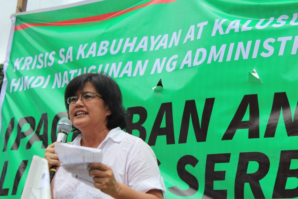 Dr. Julie Caguiat, co-convenor of Coalition for People's Right to Health speaking in a program at Chino Roces bridge on July 19. (Contributed photo)