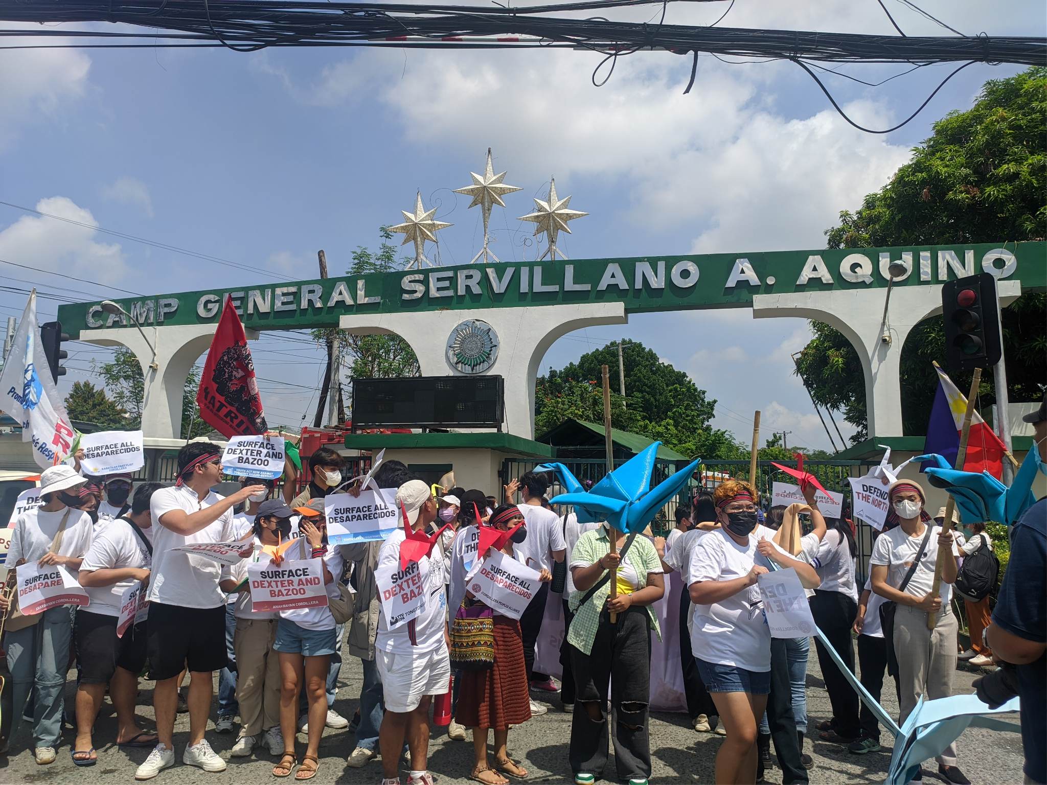 Activists hold a protest in front of Camp Servillano Aquino June 7 to demand the military to surface Dexter Capuyan and Gene Roz Jamil "Bazoo" dela Cruz.