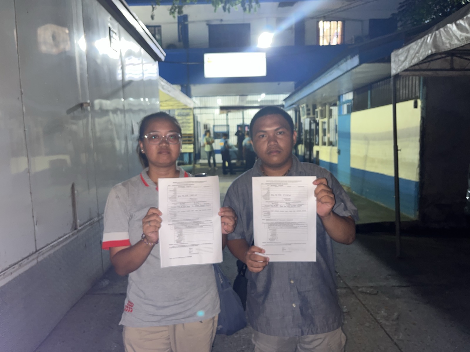 Serrano’s paralegals hold up unsigned forms confirming their client is not under police custody